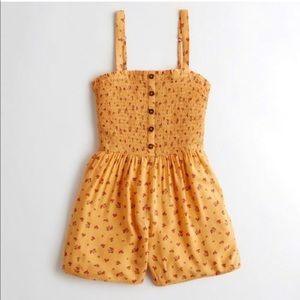 Yellow Smocked Floral Buttoned down Romper